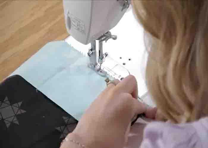 Sewing the pieces of the reversible quilt top