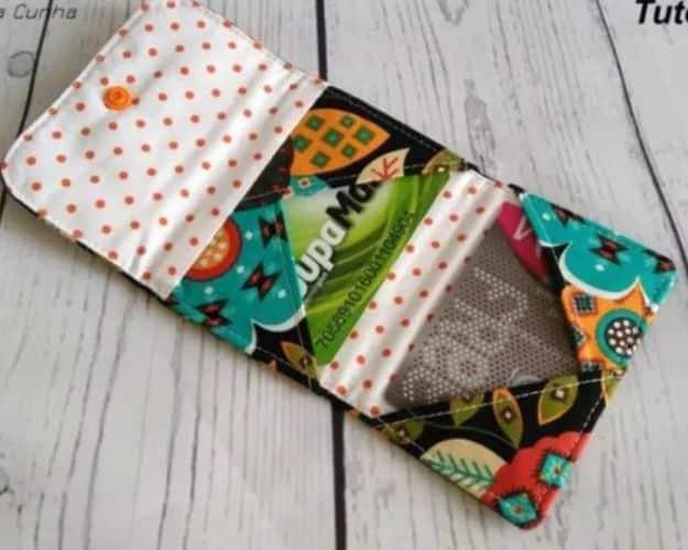 Criss cross card mini wallet, an open wallet with diagonal card slots in an owl print and a cream polka dot lining
