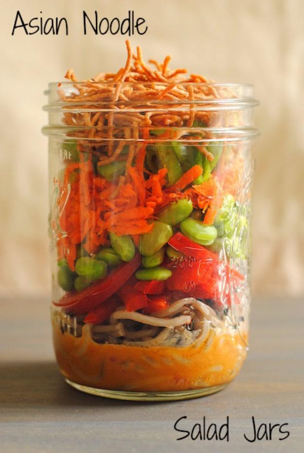 Asian noodle salad jars with soba noodles, crisp vegetables and roasted peanuts over a creamy peanut dressing