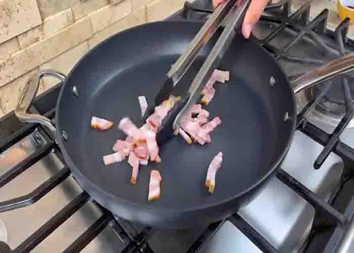 Frying the bacon strips for the fried rice recipe