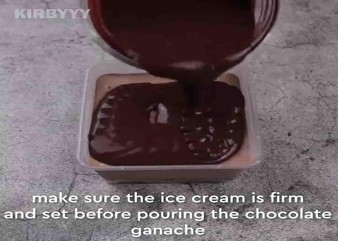 Pouring the chocolate ganache over the dream cake ice cream