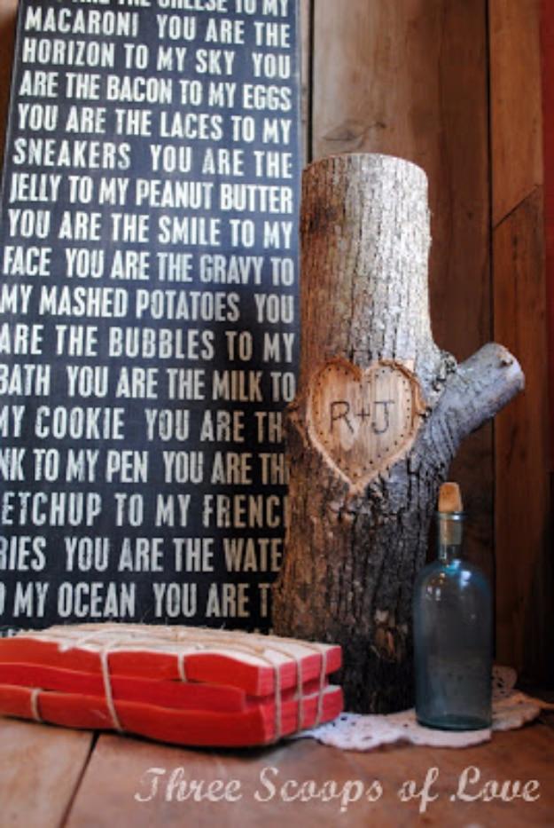 Painted tree artwork with two names in a carved heart on the trunk framed as a Valentine gift idea for February 14