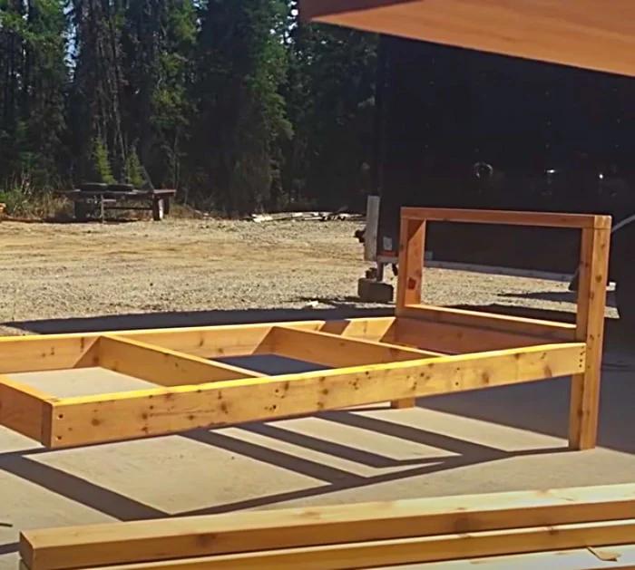 Make an easy outdoor sofa out of two by four wood