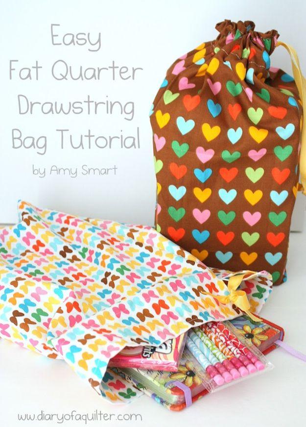Easy fat quarter drawstring bag in a brown rainbow heart print beside a second bag full of art supplies
