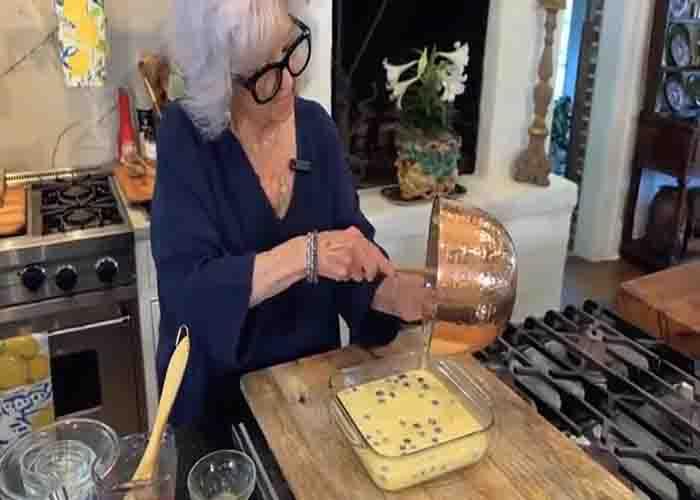 Transferring the blueberry cornbread batter to the baking pan