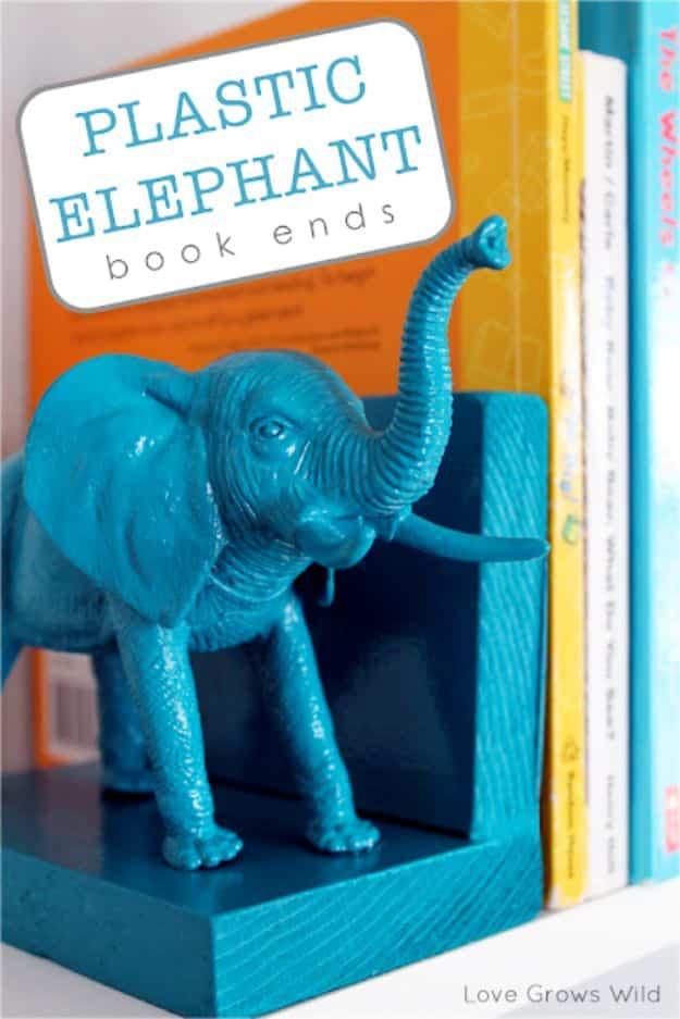 Plastic elephant book ends graphic with a teal painted elephant holding up a row of colorful hardcovers