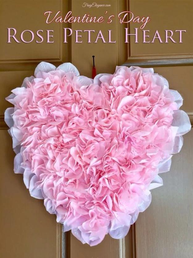 Rose petal heart, a pink and white ruffled heart wreath of artificial rose petals hanging on a paneled wood door