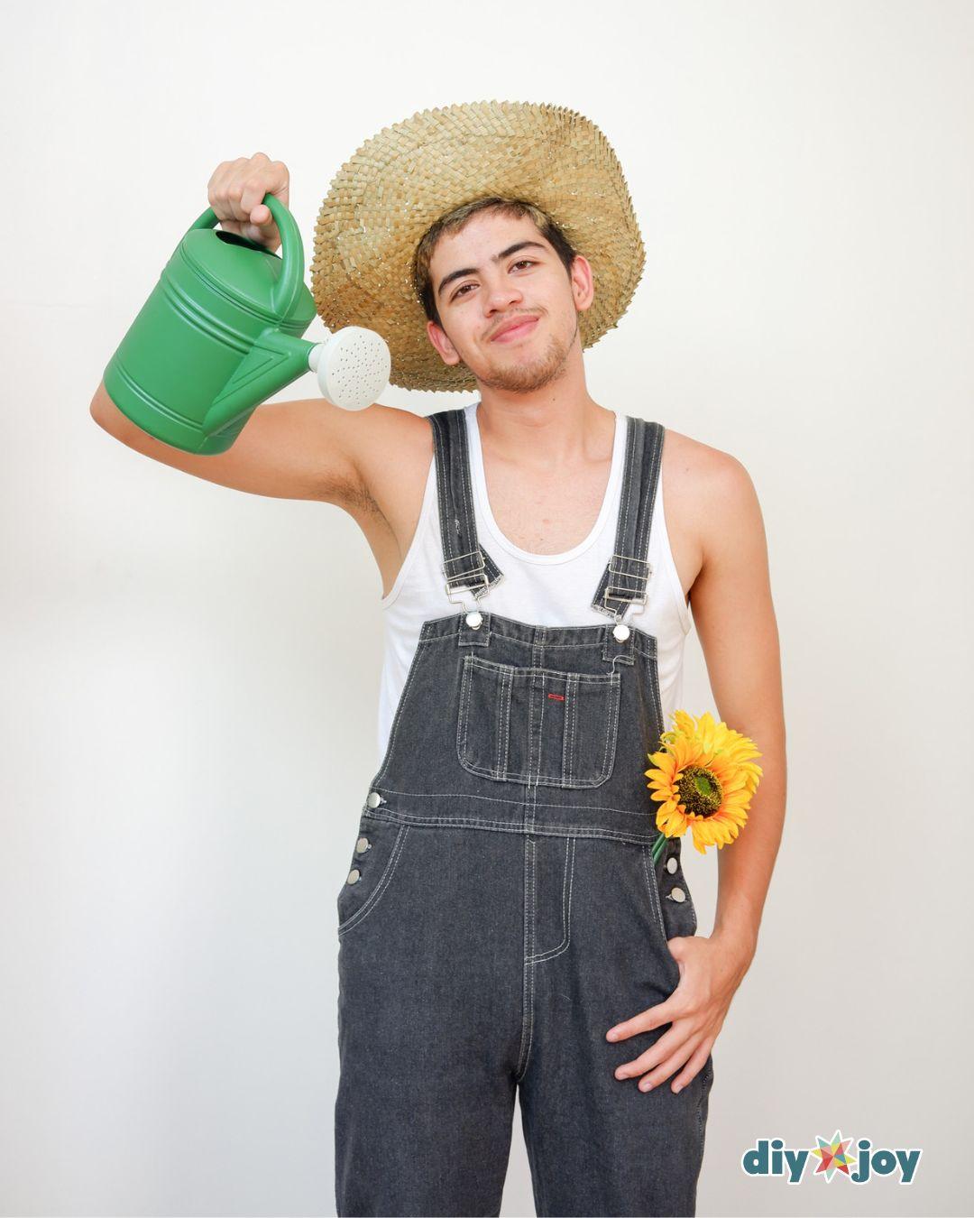 Easy Couples Costume Sunflower And Gardener - gardener halloween costume with a straw hat, overalls, and a watering can.