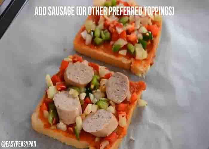 Adding the pizza toppings over the bread