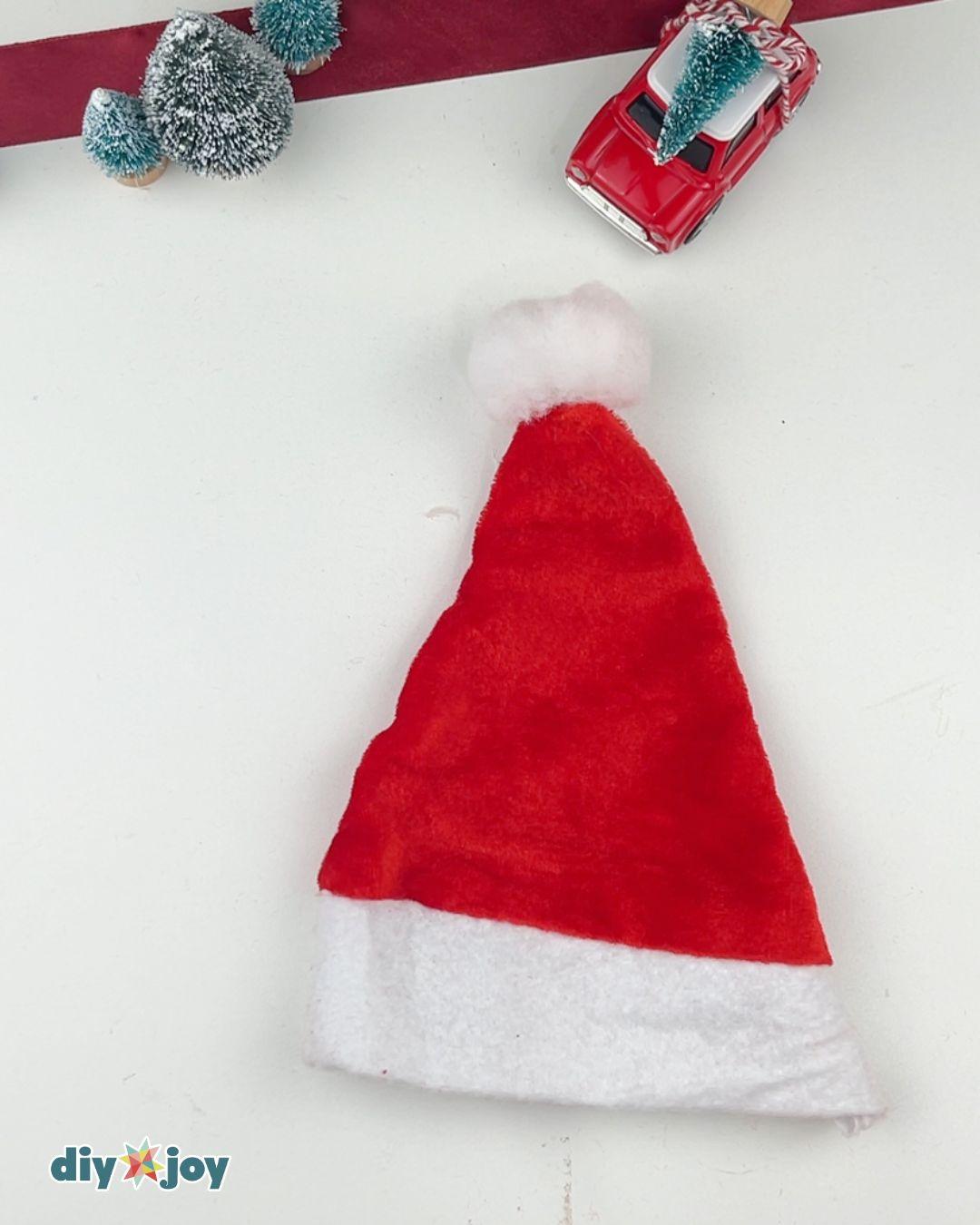 Santa Chocolate Jar — gluing the pompom ball