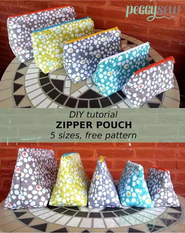 Three lined zipper pouches in small, medium and large, sewn in coordinating prints and fanned out on a craft fair table