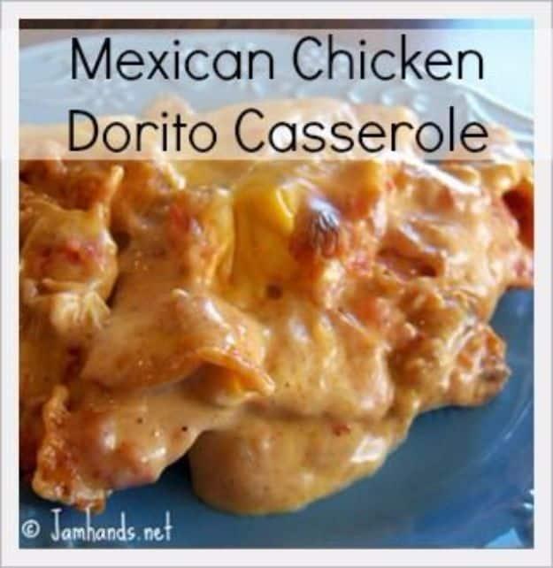 Mexican Dorito casserole scooped onto a blue plate, creamy with shredded chicken, Rotel, chips and cheddar