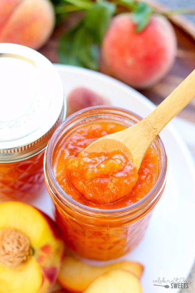 Easy peach vanilla jam in a jar, golden and flecked with vanilla bean seeds, beside fresh sliced peaches