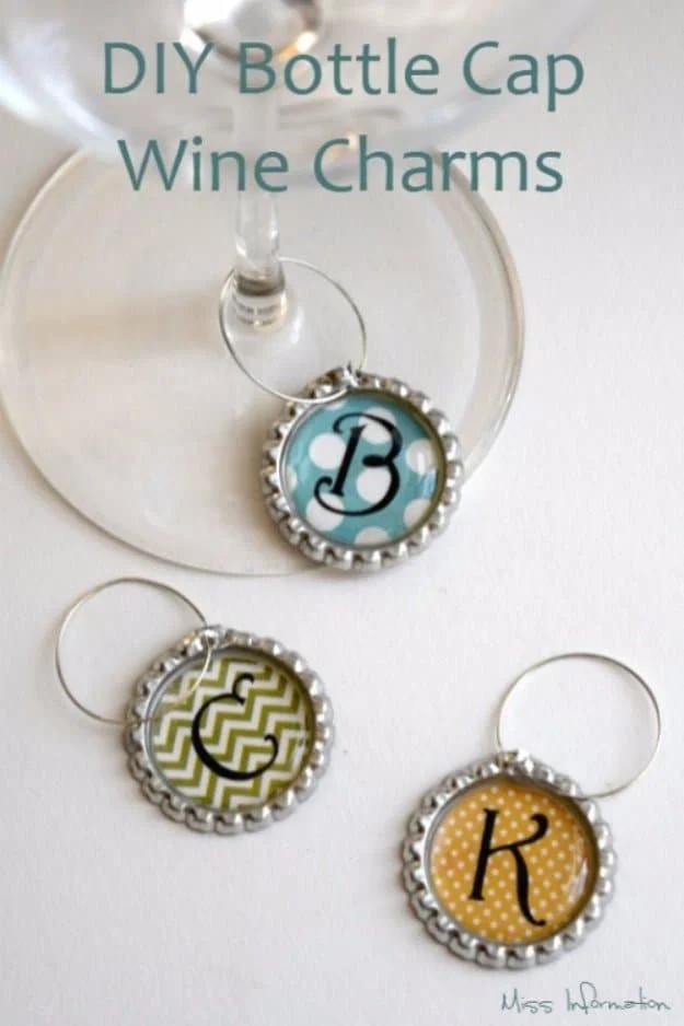 Six flattened bottle caps punched and hung from silver wire hoops, clipped around the stems of clear wine glasses