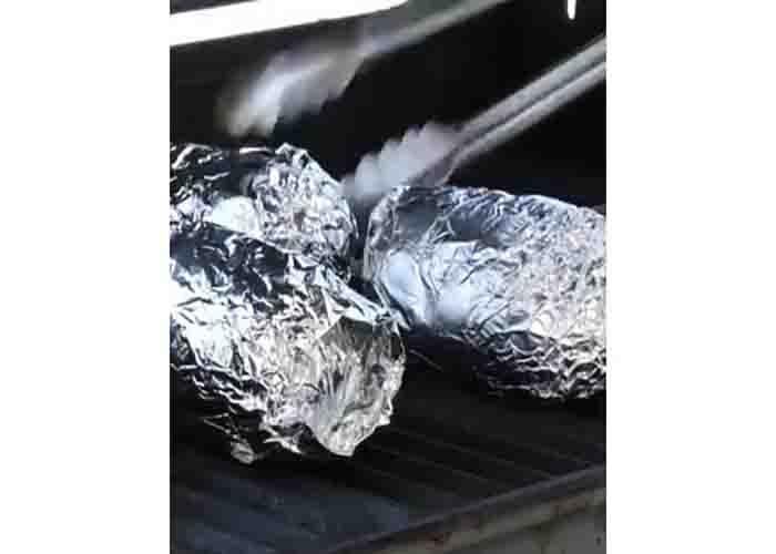 Grilling the potatoes for the potato volcanoes recipe