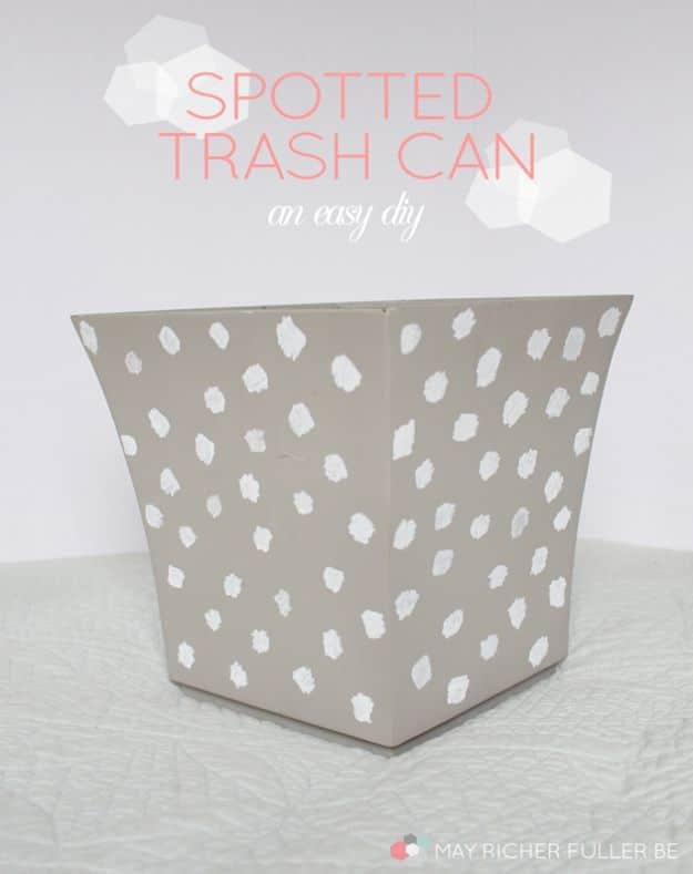 Gray tapered trash can covered in irregular freehand white dots, under a pale typeset title on a plain white backdrop