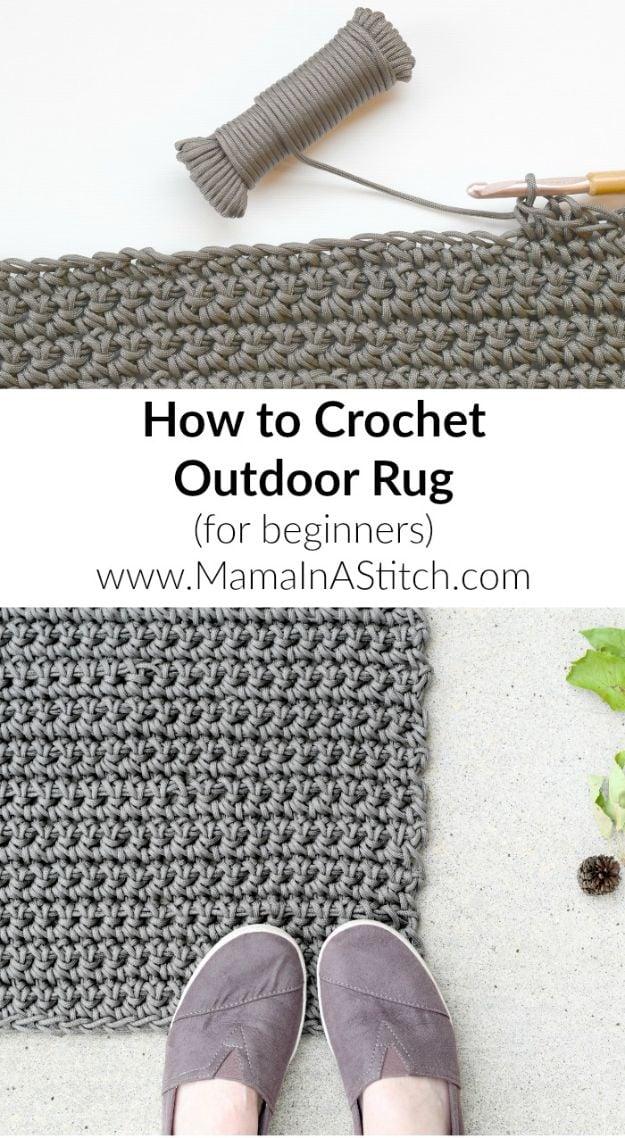 Grey paracord DIY outdoor rug worked in single crochet on a concrete step with a ball of cord and a crochet hook