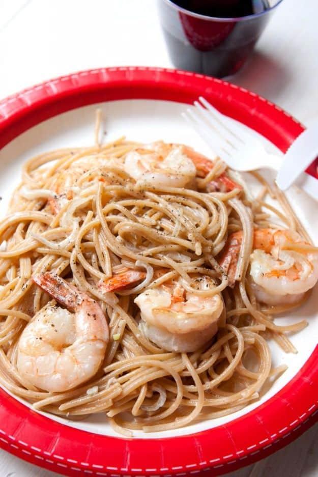 Shrimp scampi for one served over spaghetti with garlic, shallot, butter sauce and grated parmesan cheese