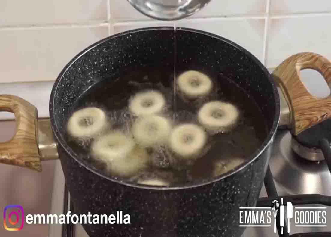 Frying the mini glazed donuts