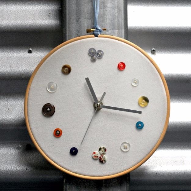 DIY button clock, an embroidery hoop clock with mismatched vintage buttons marking the hours and black clock hands
