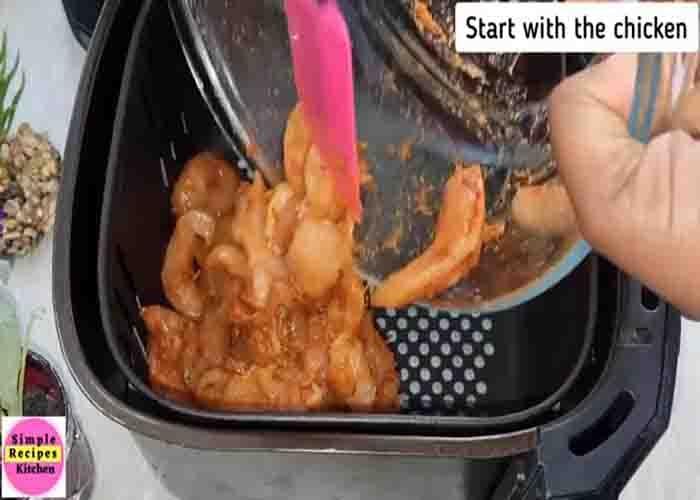Air frying the chicken strips