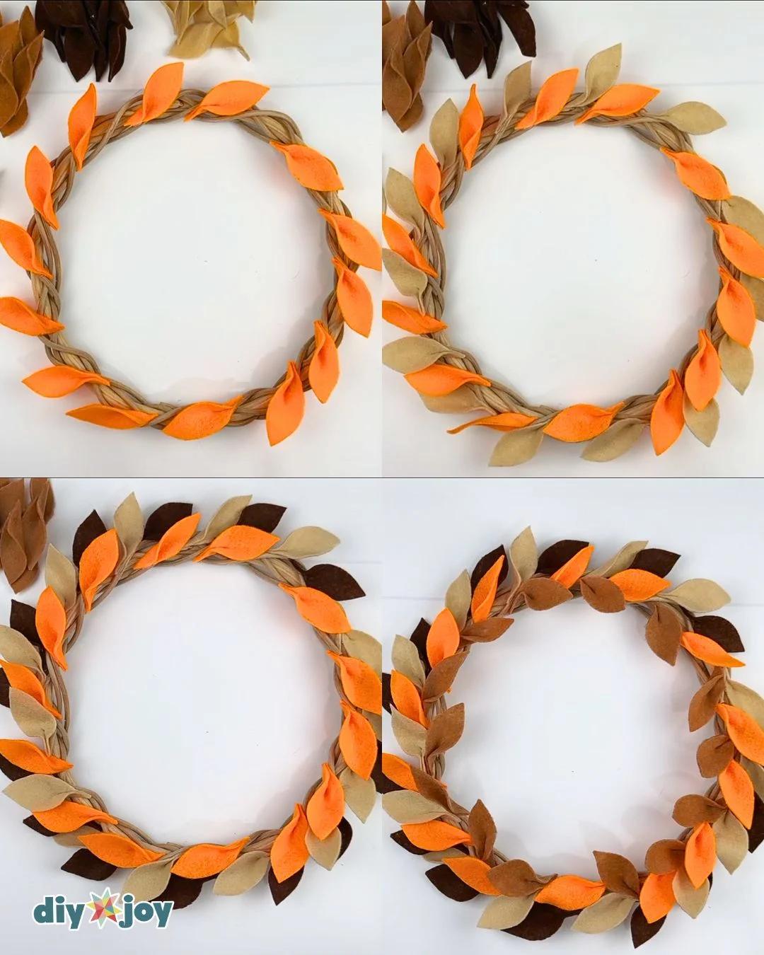 DIY fall wreath - gluing orange, light brown, and white felt leaves onto the wreath form, the first layer glued evenly.