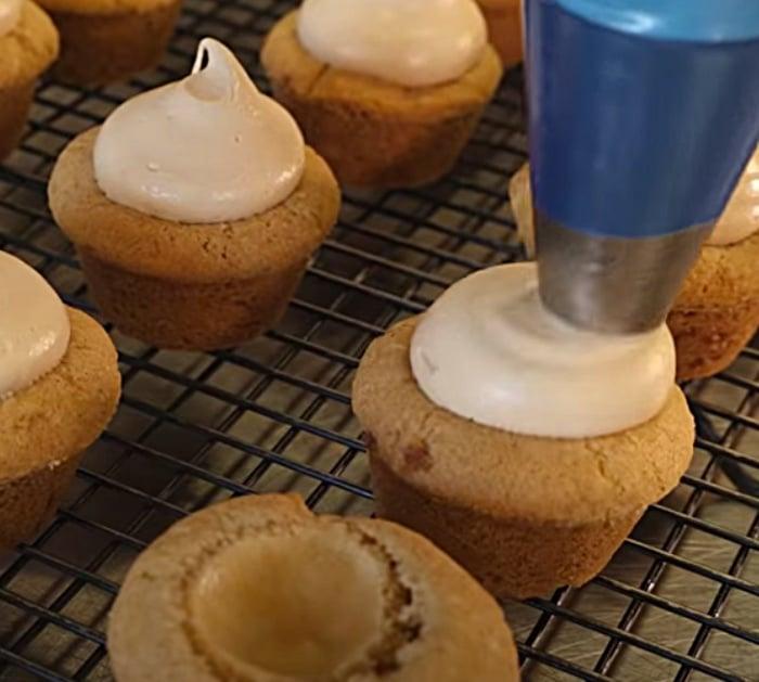Butter cream frosting on a cookie cheesecake cup