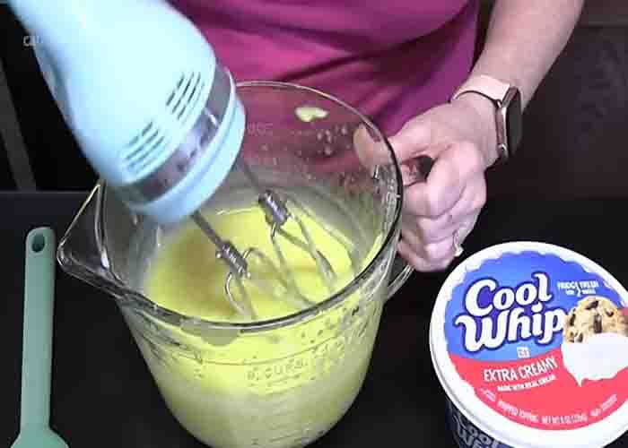 Making the pudding mixture for the no-bake lemon dessert cake recipe