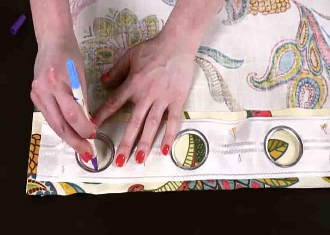 Tracing the grommet tape on the curtain
