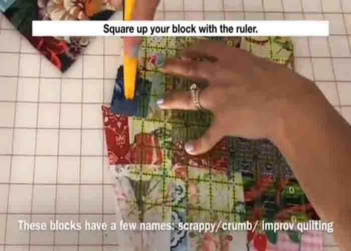Trimming the scrappy crumb quilt block to the final size