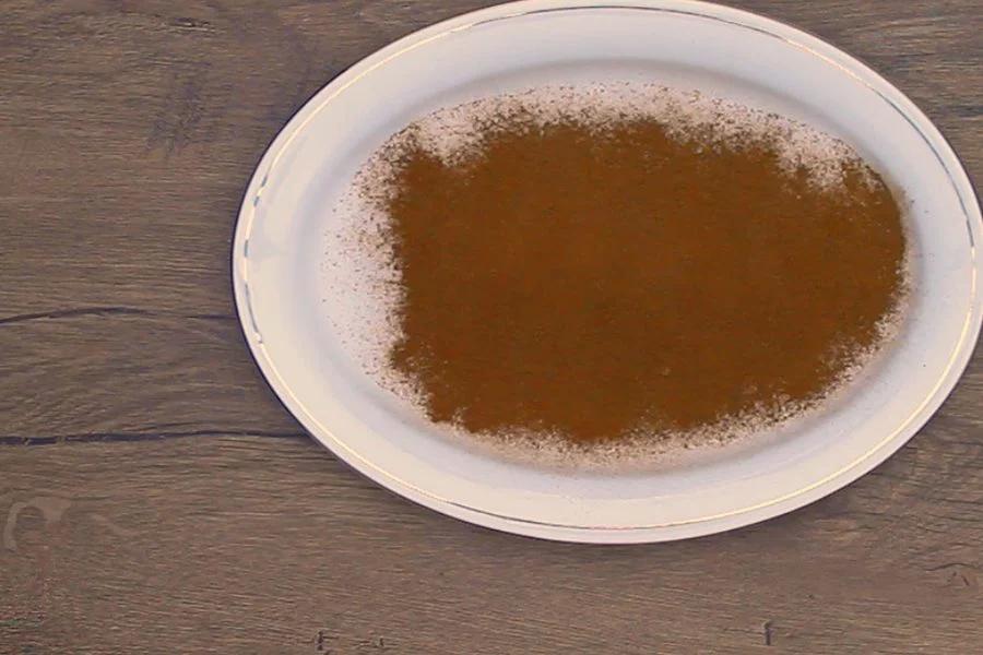 A plate of cinnamon sugar mixed for coating copycat Dollywood cinnamon bread