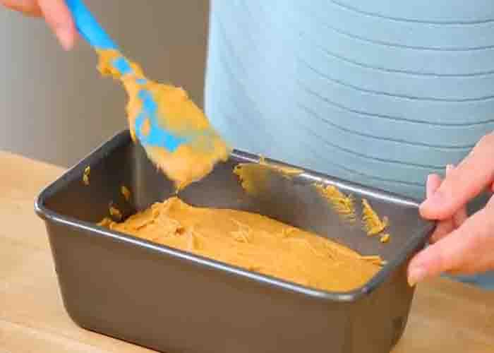 Transferring the bread batter in the loaf pan
