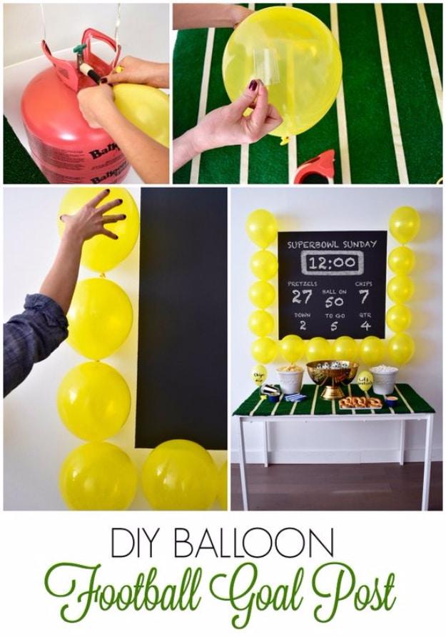 Yellow balloons taped around a chalkboard as football goal posts, shown being inflated and finished behind a party table