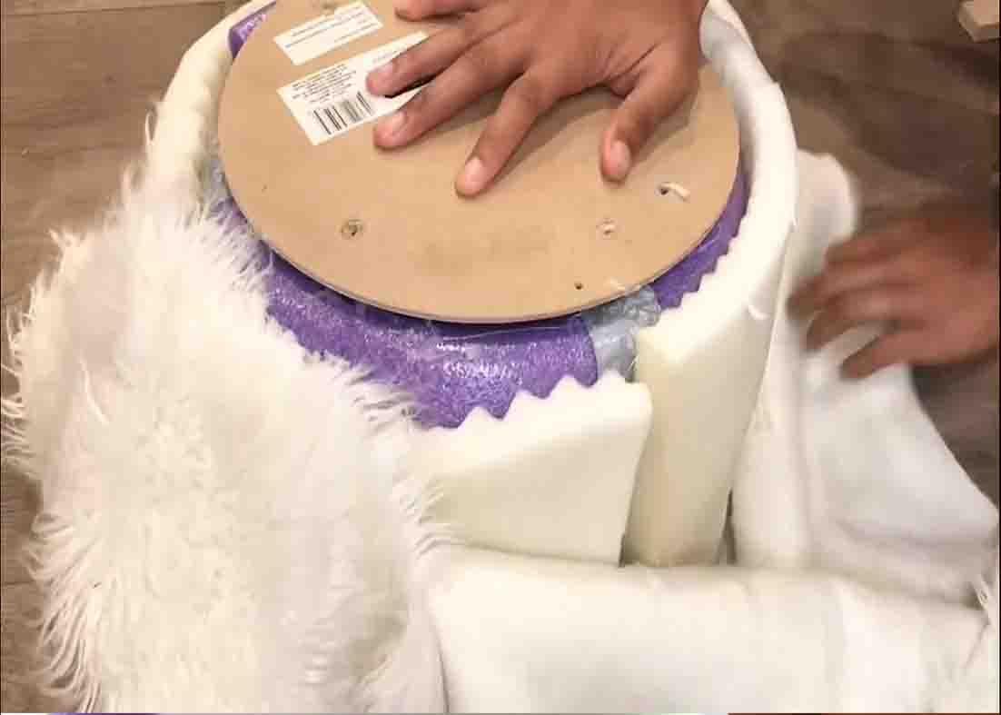 Wrapping the DIY ottoman with fur