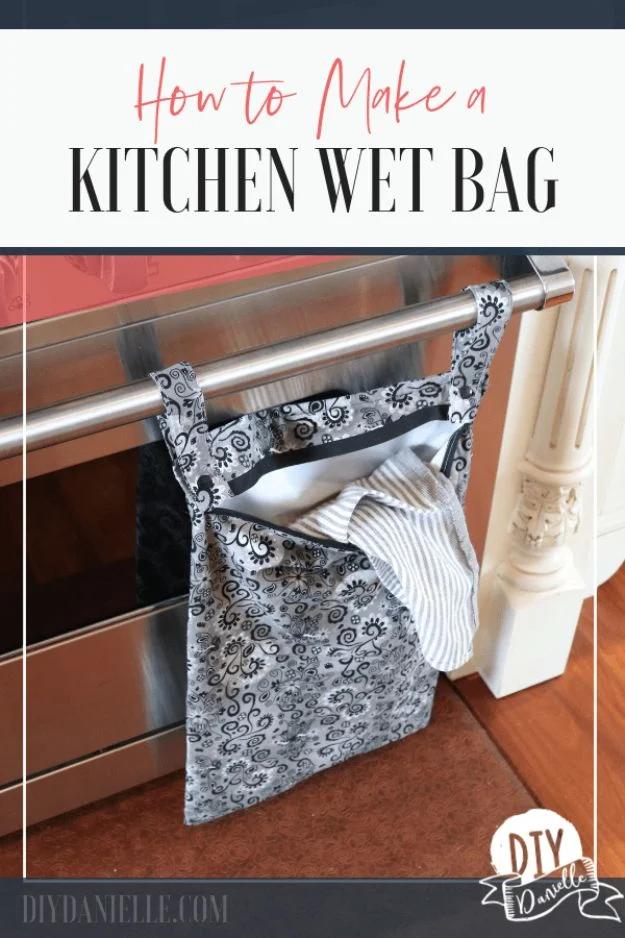 A waterproof wet bag in printed cotton with a PUL lining and a long zipper, sitting open on a laundry bench.