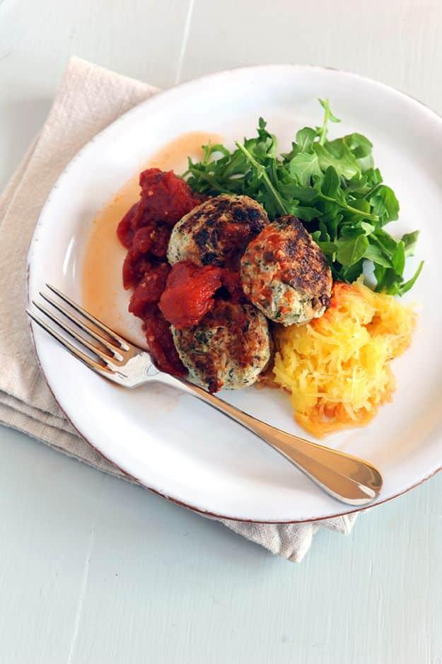 Turkey meatballs with herbs served over roasted spaghetti squash, a healthy celebrity inspired dinner