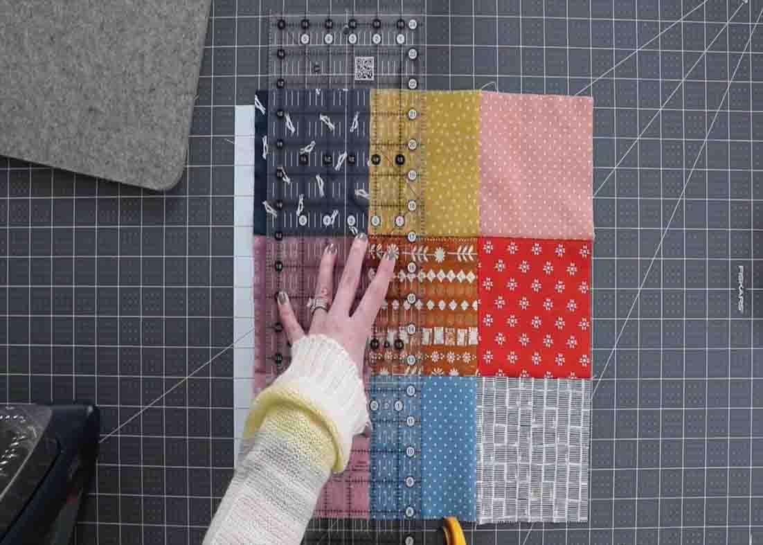 Cutting the block on both sides to create the disappearing nine patch