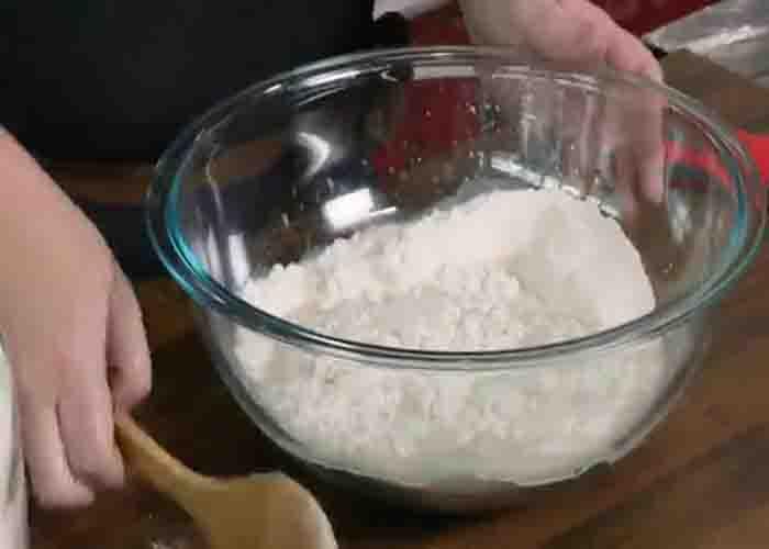 Combing the dry ingredients to make the pizza dough