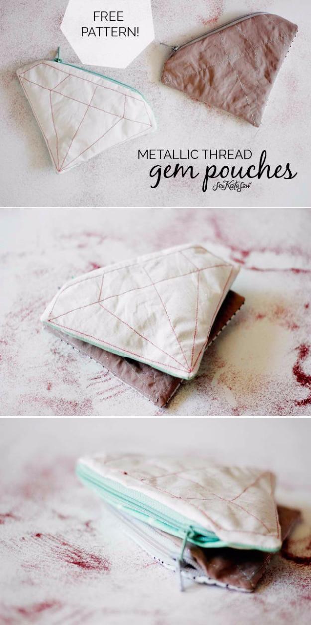 A gem shaped zip pouch in blush cotton with a metallic gold vinyl panel, catching the light on a craft fair table