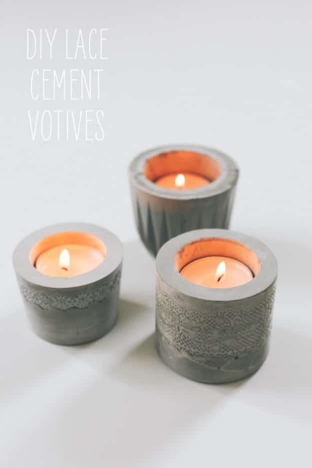 DIY laced concrete votives, four short gray cement tealight holders with lace texture pressed into the lower half