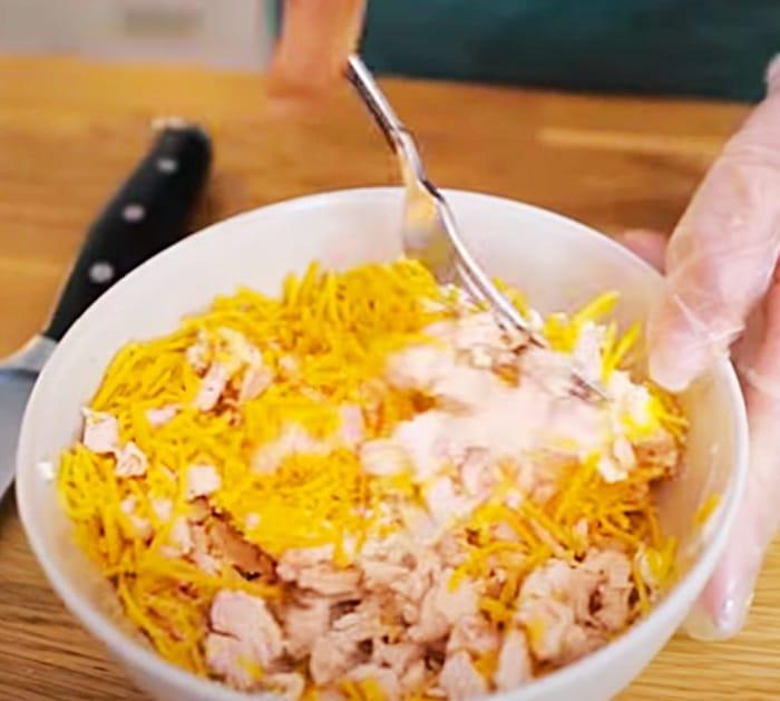 Make chicken and cream cheese filling for jalapeno poppers