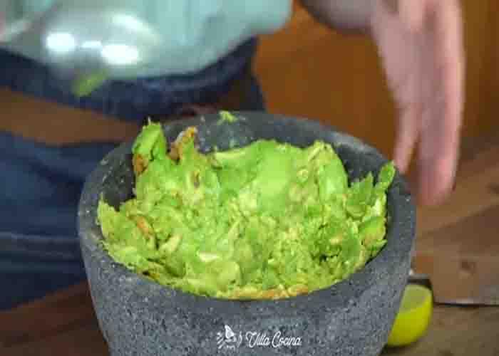 Making the garlic roasted guacamole