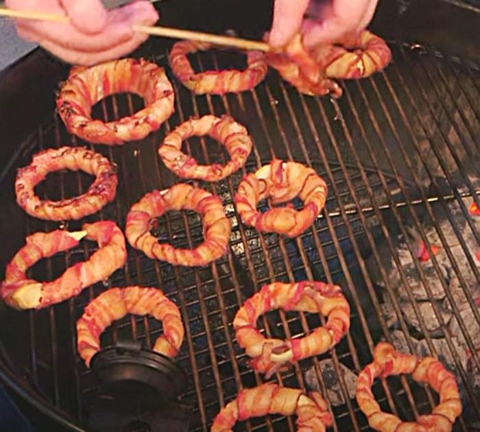 Wrap bacon around onion rings and grill