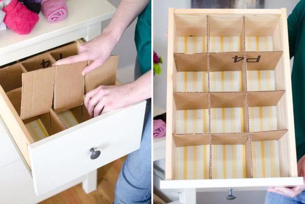 Cardboard craft drawer dividers being fitted into a white drawer forming a grid of cardboard compartments