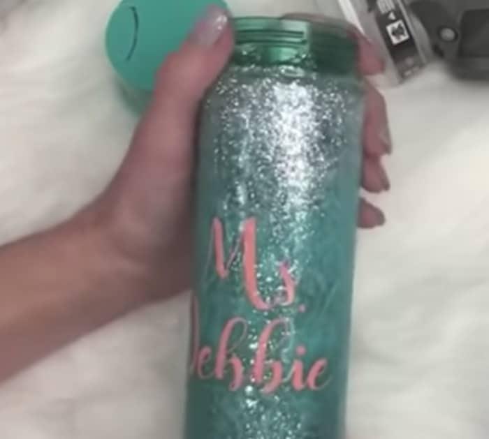 Make a glittered water bottle tumbler from Dollar Tree