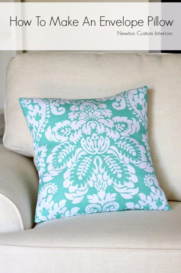How to make an envelope pillow, a home sewing project with a teal damask envelope back pillow cover on a cream sofa