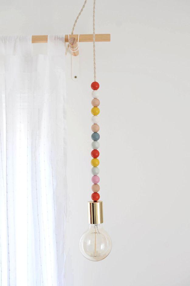 DIY Wooden Bead Pendant Light, a creative way to light up a quiet corner and an easy DIY lighting project to brighten a space
