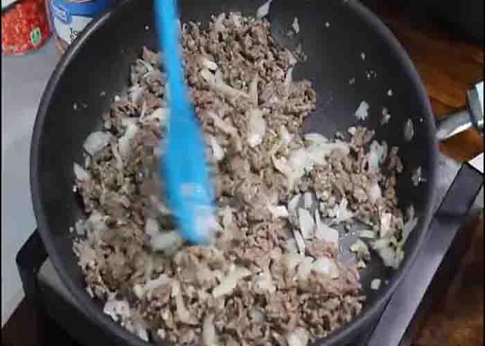 Cooking the ground beef for the casserole recipe