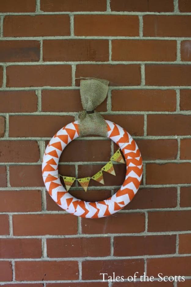 Candy corn wreath color blocked from the materials themselves rather than paint, a bright autumn wreath