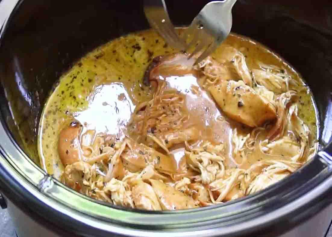 Shredding the honey mustard chicken breasts before serving